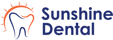 Logo for Sunshine Dental featuring a tooth symbol with a sun design above it in orange and blue text.